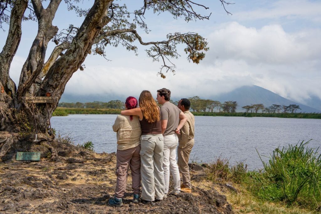 IM_TZ_SER_Guide and guests looking at tree